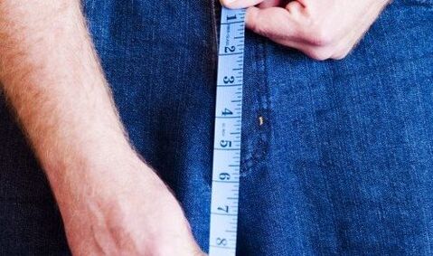Man measures the length of the penis